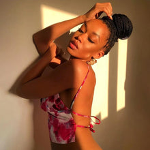 Load image into Gallery viewer, This satin tie die festival top is sure to take your weekend look that extra mile. Featuring a pink, white and baby blue material with a backless design and thin strap detailing, cowl neckline and a cropped length. Style with blue jeans and high heels for a date night with the bae.