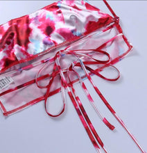 Load image into Gallery viewer, This satin tie die festival top is sure to take your weekend look that extra mile. Featuring a pink, white and baby blue material with a backless design and thin strap detailing, cowl neckline and a cropped length. Style with blue jeans and high heels for a date night with the bae.