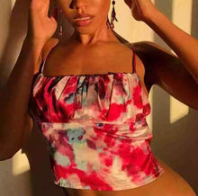 Load image into Gallery viewer, This satin tie die festival top is sure to take your weekend look that extra mile. Featuring a pink, white and baby blue material with a backless design and thin strap detailing, cowl neckline and a cropped length. Style with blue jeans and high heels for a date night with the bae.