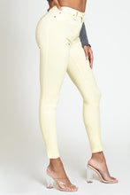 Load image into Gallery viewer, If you don&#39;t have this closet essential, you are missing out! These high rise, yellow, skinny jeans are made of super stretchy material and making them the jeans that every girl needs. They feature two back pockets and a front zipper and button to close. These are the pants that you can wear to work, dinner, or the club. Pair with heels and a great top to create the perfect outfit.
