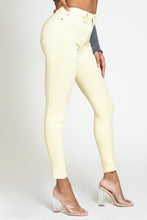 Load image into Gallery viewer, If you don't have this closet essential, you are missing out! These high rise, yellow, skinny jeans are made of super stretchy material and making them the jeans that every girl needs. They feature two back pockets and a front zipper and button to close. These are the pants that you can wear to work, dinner, or the club. Pair with heels and a great top to create the perfect outfit.