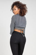 Load image into Gallery viewer, If you don't have this closet essential, you are missing out! These high rise, black, skinny jeans are made of super stretchy material and making them the jeans that every girl needs. They feature two back pockets and a front zipper and button to close. These are the pants that you can wear to work, dinner, or the club. Pair with heels and a great top to create the perfect outfit.