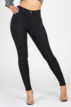 Load image into Gallery viewer, If you don't have this closet essential, you are missing out! These high rise, black, skinny jeans are made of super stretchy material and making them the jeans that every girl needs. They feature two back pockets and a front zipper and button to close. These are the pants that you can wear to work, dinner, or the club. Pair with heels and a great top to create the perfect outfit.