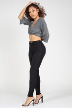 Load image into Gallery viewer, If you don't have this closet essential, you are missing out! These high rise, black, skinny jeans are made of super stretchy material and making them the jeans that every girl needs. They feature two back pockets and a front zipper and button to close. These are the pants that you can wear to work, dinner, or the club. Pair with heels and a great top to create the perfect outfit.