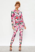 Load image into Gallery viewer, We're bringing you the ultimate Flowers and Camo tracksuit! Perfect for building your favorite looks all year round. This tracksuit is luxurious, has excellent stretch, and extremely comfortable. The jacket is long sleeve, soft stretch fit, with a front zipper. The bottoms are stretchy waistband and hugs you in all the right places. Pair with transparent heels, gold jewelry to create a cute and casual look.