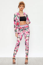 Load image into Gallery viewer, We're bringing you the ultimate Flowers and Camo tracksuit! Perfect for building your favorite looks all year round. This tracksuit is luxurious, has excellent stretch, and extremely comfortable. The jacket is long sleeve, soft stretch fit, with a front zipper. The bottoms are stretchy waistband and hugs you in all the right places. Pair with transparent heels, gold jewelry to create a cute and casual look.