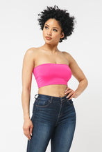Load image into Gallery viewer, This tube top is everything that you need switch up your wardrobe with our Sweet As Candy Tube Top. Featuring a vibrant fuchsia soft cotton blend material with a bandeau neckline and a cropped length, we are obsessed. Wear this with high waist pants and high heels or sandals for the ultimate cute or casual look that you will absolutely love.