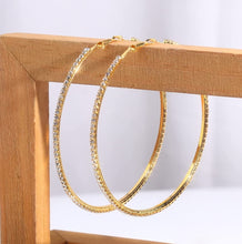 Load image into Gallery viewer, Add some sparkle and shine with these beautifully detailed gold hoop earrings. Featuring jeweled detailing on a gold-tone setting, these earrings are perfect for all occasions.