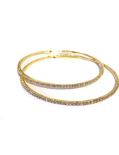 Load image into Gallery viewer, Add some sparkle and shine with these beautifully detailed gold hoop earrings. Featuring jeweled detailing on a gold-tone setting, these earrings are perfect for all occasions.
