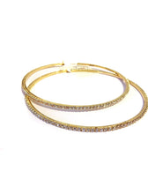Load image into Gallery viewer, Add some sparkle and shine with these beautifully detailed gold hoop earrings. Featuring jeweled detailing on a gold-tone setting, these earrings are perfect for all occasions.