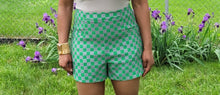Load image into Gallery viewer, Add some style to your wardrobe with these lightweight, high-waisted shorts. Our Make it Official Shorts feature a checkerboard pattern design, two front pockets. The flow shorts are perfect for a day party, paired with a statement necklace and heels.