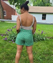 Load image into Gallery viewer, Add some style to your wardrobe with these lightweight, high-waisted shorts. Our Make it Official Shorts feature a checkerboard pattern design, two front pockets. The flow shorts are perfect for a day party, paired with a statement necklace and heels.