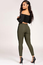 Load image into Gallery viewer, Upgrade your casual look this season with these olive high waisted pants. Made of materials that allows great stretch and flexibility. These leggings come in a soft material featuring an elasticated waist band and black twill side seam design. Style with a simple bodysuit and heels to complete the look.