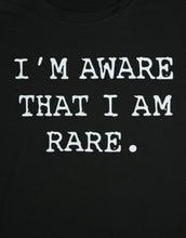 Load image into Gallery viewer, This is a must in your wardrobe! Our I'm Aware That I'm Rare Top has plenty of confidence and is a statement piece. Has a crew neck, short sleeves, loose fitting and soft fabric. Style it with your favorite jeans and high heels for an elevated casual look.