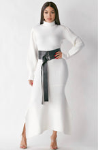 Load image into Gallery viewer, Keep cozy in this effortless cashmere turtleneck sweater dress this season. This white turtleneck sweater dress should be in every closet. Featuring a soft ribbed knitted fabric, turtle neck, puff sleeves and a faux leather waist belt. Team this with sexy boots and simple accessories to complete the look.