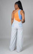 Load image into Gallery viewer, In The Mix Denim Sweatpants. These bottoms are made from a mix of heather grey cotton sweat and light wash denim fabrication. These pants feature distressed rips at the knees, straight leg pants, an elastic waistband, two front and back pockets, and a button detail. Style these with a cropped hoodie and a pair of white sneakers!