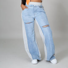 Load image into Gallery viewer, In The Mix Denim Sweatpants. These bottoms are made from a mix of heather grey cotton sweat and light wash denim fabrication. These pants feature distressed rips at the knees, straight leg pants, an elastic waistband, two front and back pockets, and a button detail. Style these with a cropped hoodie and a pair of white sneakers!