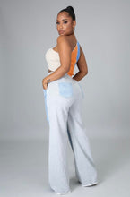 Load image into Gallery viewer, In The Mix Denim Sweatpants. These bottoms are made from a mix of heather grey cotton sweat and light wash denim fabrication. These pants feature distressed rips at the knees, straight leg pants, an elastic waistband, two front and back pockets, and a button detail. Style these with a cropped hoodie and a pair of white sneakers!