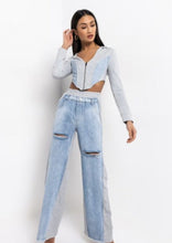 Load image into Gallery viewer, In The Mix Denim Sweatpants. These bottoms are made from a mix of heather grey cotton sweat and light wash denim fabrication. These pants feature distressed rips at the knees, straight leg pants, an elastic waistband, two front and back pockets, and a button detail. Style these with a cropped hoodie and a pair of white sneakers!