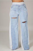 Load image into Gallery viewer, In The Mix Denim Sweatpants. These bottoms are made from a mix of heather grey cotton sweat and light wash denim fabrication. These pants feature distressed rips at the knees, straight leg pants, an elastic waistband, two front and back pockets, and a button detail. Style these with a cropped hoodie and a pair of white sneakers!