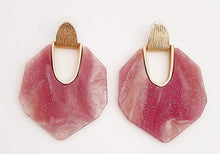 Load image into Gallery viewer, Redefine your look covering with a touch of sparkle. We are loving the detailing in these hot pink earrings! Featuring a geometric shape, marble detailing, and post-back closures, they're a must-have!