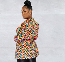 Load image into Gallery viewer, A statement blazer is a must-have this season. It commands attention, and our It's All About You Blazer is the perfect way to achieve just that! The asymmetrical V print design adds a touch of glamour. Featuring a classic collar neckline, button closure wear over our black faux leather leggings and a white bodysuit with pumps, for the perfect statement look!