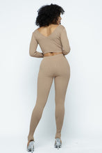 Load image into Gallery viewer, This Just Chill Set is every wardrobe essential. Featuring a nude rib kitted fabric with a V neckline top with long sleeves, high rise pants with soft elasticized waistband, lightweight material. Style with a high heel or boots and handbag for a weekend look you'll love!