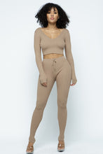 Load image into Gallery viewer, This Just Chill Set is every wardrobe essential. Featuring a nude rib kitted fabric with a V neckline top with long sleeves, high rise pants with soft elasticized waistband, lightweight material. Style with a high heel or boots and handbag for a weekend look you'll love!