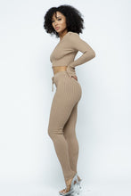Load image into Gallery viewer, This Just Chill Set is every wardrobe essential. Featuring a nude rib kitted fabric with a V neckline top with long sleeves, high rise pants with soft elasticized waistband, lightweight material. Style with a high heel or boots and handbag for a weekend look you'll love!