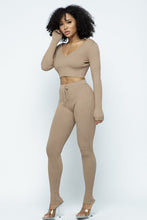 Load image into Gallery viewer, This Just Chill Set is every wardrobe essential. Featuring a nude rib kitted fabric with a V neckline top with long sleeves, high rise pants with soft elasticized waistband, lightweight material. Style with a high heel or boots and handbag for a weekend look you'll love!