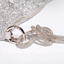 Load image into Gallery viewer, Turn heads with this must have beautiful rhinestone clutch purse. Elevate your style with dazzling glamour. Featuring a knotted top handle, slouchy pouch. This luxe bag is sure to complete your occasion look.