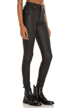 Load image into Gallery viewer, Flex your style in these cute Lex Skinny Wax Coated Denim Black Jeans the liquid wax coating design gives these jeans a chic look. Perfect for styling any and every way you want! These jeans come in a high rise fit featuring 5 pocket, zip and button closure. You can pair these with our black crop tank top, and chic fashion blazer or a graphic tee and high heels or combat boots and of course a handbag for a complete look!