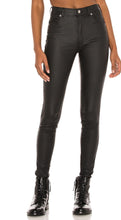 Load image into Gallery viewer, Flex your style in these cute Lex Skinny Wax Coated Denim Black Jeans the liquid wax coating design gives these jeans a chic look. Perfect for styling any and every way you want! These jeans come in a high rise fit featuring 5 pocket, zip and button closure. You can pair these with our black crop tank top, and chic fashion blazer or a graphic tee and high heels or combat boots and of course a handbag for a complete look!