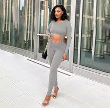 Load image into Gallery viewer, Show off those sexy curves this summer girl! Great for a night out! This jumpsuit features a ribbed material, long sleeve, round neckline and design. Pair this with a simple flat to keep it casual or a chic high heel and handbag for a spiced up look we love!