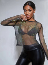 Load image into Gallery viewer, Can you feel the love tonight in this season with this flirty top is made from a rhinestone netting fabrication, long sleeve and is complete with a crew neckline. This top will make any outfit special. Style this mesh rhinestone crop over your favorite bralette top and a pair of high waisted leather pants for a sexy glam date night look!
