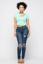 Load image into Gallery viewer, Crop tops are essential in every girls wardrobe and we're obsessing over our vibrant mint crop top. Featuring a stretch kitted material with short sleeves and a round neckline, and a cut-out detailing which exposes the skin for a real statement-making look. Pair with your favorite blue wash denim jeans or with cargos and high heels to complete the look