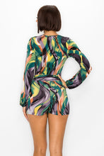 Load image into Gallery viewer, Elevate your wardrobe with this bold sexy romper. Featuring a trendy swirl print with adjustable belt, we are obsessed. Pair with heels and accessories for a look that is sure to make a statement this season.