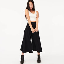 Load image into Gallery viewer, Add just the right touch of edge to your look with this sexy cami crop top. Featuring a round neckline, our thick tank straps and a cropped fit. Pair with our faux leather leggings or our "Hybrid Dream Jeans", high heels and statement handbag for a complete look we're loving.
