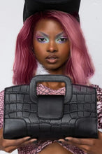 Load image into Gallery viewer, Finish off your evening look with this classy handbag babe. Featuring a black faux leather material, and this bag comes with a crossbody strap, a gold link strap for the shoulder, front flap design and a metal popper fastening. Style with any of your night time looks!