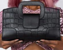 Load image into Gallery viewer, Finish off your evening look with this classy handbag babe. Featuring a black faux leather material, and this bag comes with a crossbody strap, a gold link strap for the shoulder, front flap design and a metal popper fastening. Style with any of your night time looks!
