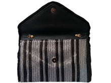 Load image into Gallery viewer, After looking high and low, traveling far and wide, our journey finally brought us to Night Life Sequin Clutch! This cute black clutch features rows of stunning black and silver sequin, and black fringe. Lift the top from the hidden magnetic closure to find a striped, lined interior with a sidewall pocket. Detachable chain strap.