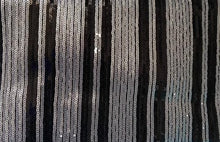 Load image into Gallery viewer, After looking high and low, traveling far and wide, our journey finally brought us to Night Life Sequin Clutch! This cute black clutch features rows of stunning black and silver sequin, and black fringe. Lift the top from the hidden magnetic closure to find a striped, lined interior with a sidewall pocket. Detachable chain strap.