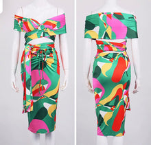 Load image into Gallery viewer, This sexy Picasso skirt set is everything and a definite must have for your wardrobe babe. Easy to style and has plenty stretch! This super cute skirt set comes in a mid length featuring a ruched detail, elastic waistband and matching cross wrap top. Pair with a statement high heels and handbag for a complete look.