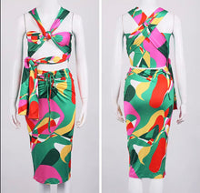 Load image into Gallery viewer, This sexy Picasso skirt set is everything and a definite must have for your wardrobe babe. Easy to style and has plenty stretch! This super cute skirt set comes in a mid length featuring a ruched detail, elastic waistband and matching cross wrap top. Pair with a statement high heels and handbag for a complete look.