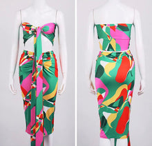 Load image into Gallery viewer, This sexy Picasso skirt set is everything and a definite must have for your wardrobe babe. Easy to style and has plenty stretch! This super cute skirt set comes in a mid length featuring a ruched detail, elastic waistband and matching cross wrap top. Pair with a statement high heels and handbag for a complete look.