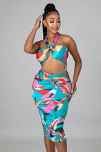 Load image into Gallery viewer, This sexy Picasso skirt set is everything and a definite must have for your wardrobe babe. Easy to style and has plenty stretch! This super cute skirt set comes in a mid length featuring a ruched detail, elastic waistband and matching cross wrap top. Pair with a statement high heels and handbag for a complete look.