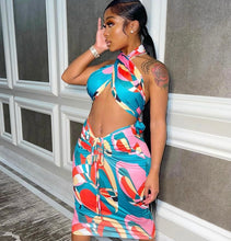 Load image into Gallery viewer, This sexy Picasso skirt set is everything and a definite must have for your wardrobe babe. Easy to style and has plenty stretch! This super cute skirt set comes in a mid length featuring a ruched detail, elastic waistband and matching cross wrap top. Pair with a statement high heels and handbag for a complete look.