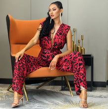 Load image into Gallery viewer, You know you need to add this sassy leopard print jumpsuit into your closet babe! This short sleeve leopard jumpsuit features a deep V-neck, high waist, open back V- cut out design. Rock this sexy jumpsuit with black high heels and a clutch and you'll be slayin' like a diva all night long.