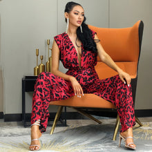 Load image into Gallery viewer, You know you need to add this sassy leopard print jumpsuit into your closet babe! This short sleeve leopard jumpsuit features a deep V-neck, high waist, open back V- cut out design. Rock this sexy jumpsuit with black high heels and a clutch and you'll be slayin' like a diva all night long.