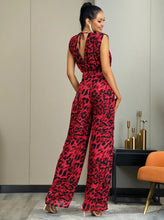 Load image into Gallery viewer, You know you need to add this sassy leopard print jumpsuit into your closet babe! This short sleeve leopard jumpsuit features a deep V-neck, high waist, open back V- cut out design. Rock this sexy jumpsuit with black high heels and a clutch and you'll be slayin' like a diva all night long.